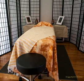 Reiki table with blankets in a comfortable reiki room